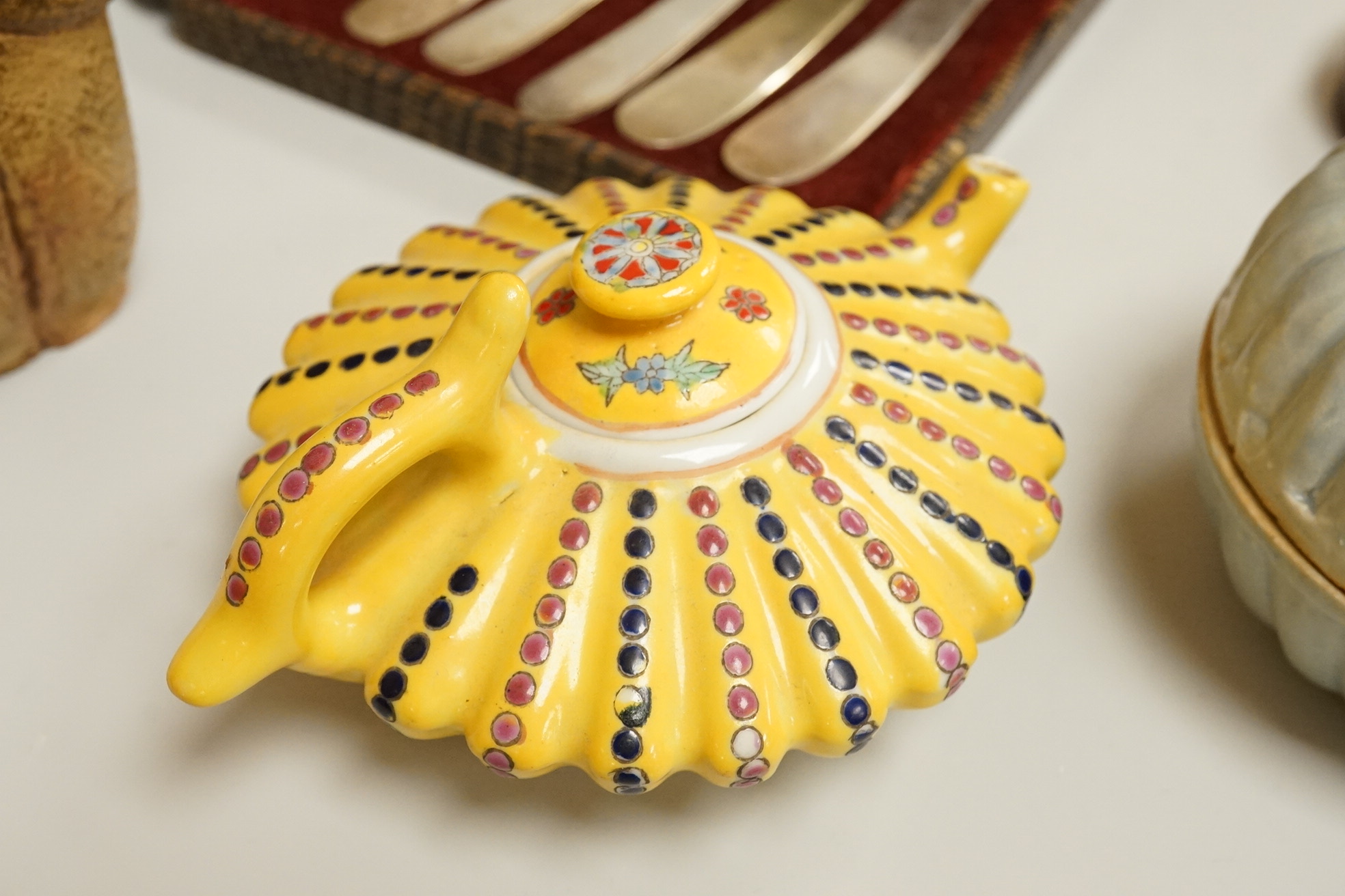 A cased set of semi-precious handled butter knives, two Chinese pottery teapots, a stoneware box and a figure, etc.